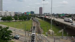 DART Train next to US75 South in Dallas Texas 4K Aerial Stock Footage