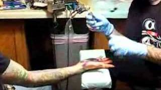 Victor gets hand palm tattoo by Tony Hundahl 2