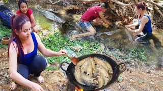 Two women cook fish with new technique