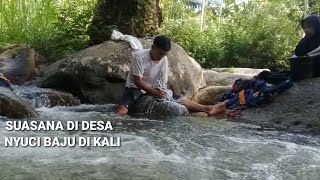 Suasana di desa, Nyuci baju di kali