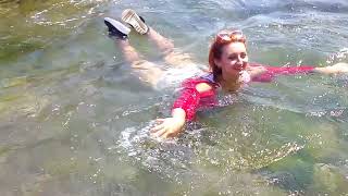 girl in stockings gets wet in the sea