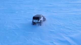 Jeep Rubicon with Rubitracks on the lake