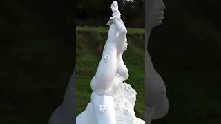 Art beautiful plaster statue in garden