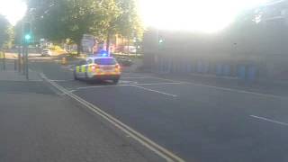 Surrey police Ford Focus estate response car on call.