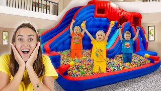 Chris and Mom play with inflatable toys