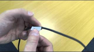 Applying self-laminating cable markers to a wire