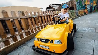 Cute Kid Driving a Yellow Car