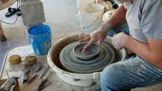 Throwing a saucer on the pottery wheel