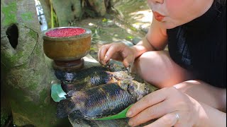 A woman in the forest all day looking for food to fill her stomach