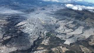 Flying over Quito/Ecuador with old airport and Cotopaxi in the background on 18AUG2019