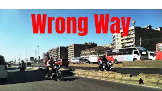 Driving from Nairobi on a Bright Day, Motor Cycles Riding the Wrong Way!!