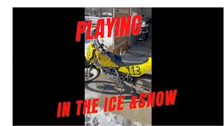 DRZ125 sliding around in the snow and ice.