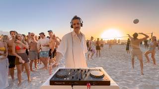 playing house music on the beach until people dance