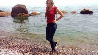 wet girl swimming in jeans