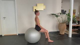 Back extension strech using pilates ball