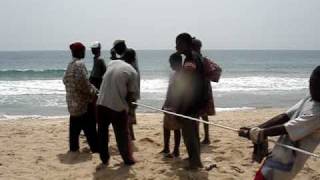 Pulling in a fishing net in Aflao