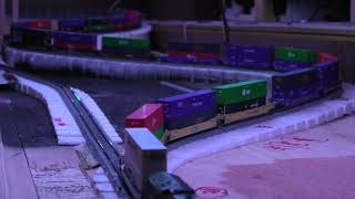 N scale intermodal train descends steep grade