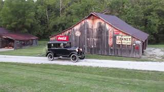 1929 Ford Model A Fordor Sedan Briggs Steel Back, puttin, headlights on.