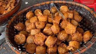 Fried banana, fried shrimp, delicious pork legs for sale on the road behind the pagoda