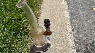 taking a massive rip in a bong