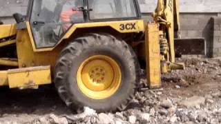 Brother grading in a old JCB