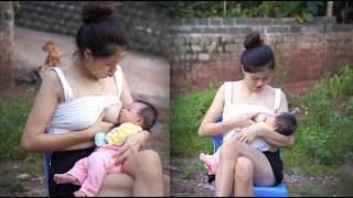 A beautiful single mother breastfeeds her child and bakes cakes for the younger siblings to eat.