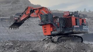 Big diger Hitachi Excavator 2500 Loading Cat 777d