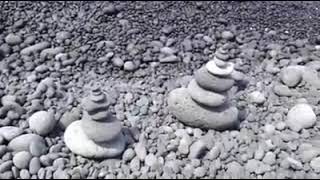 What do the stacked rocks represent??? TOURISTS~~~