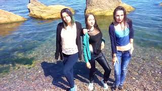 three girls enjoy swimming in the sea