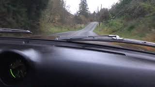 1972 Datsun 240z driving down Tester Road in Snohomish WA