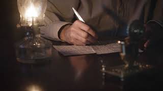 wide shot 1800s man writing with a dip pen at his desk 4k