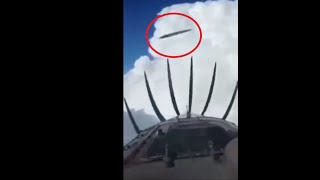 Two UFO's filmed from cockpit of turboprop airplane