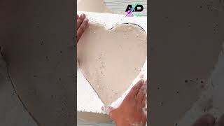 Making a love heart shaped tray with plaster of Paris.