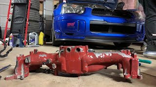 STI gets upgraded inlet, injectors, and fresh new manifold colour