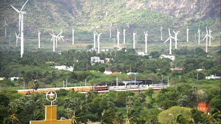 Train travels through beautiful landscape.