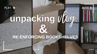 Beginning to unpack and trying to save the bookshelves