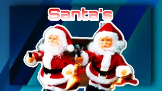 2 Moving Santa Figures with music