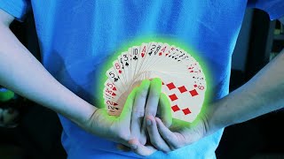 magician pulls off incredible card trick from behind his back