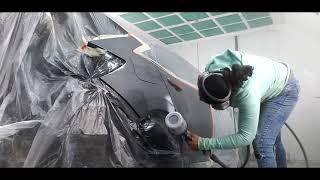 Rear end repair on 2019 Honda Civic. Female painter