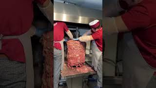 Chef preparing kebab and grill shawarma meat at a street food market