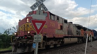 Fast BNSF manifest train with a Santa Fe fake bonnet as a leader and a Dash 9 in Superior Wisconsin.